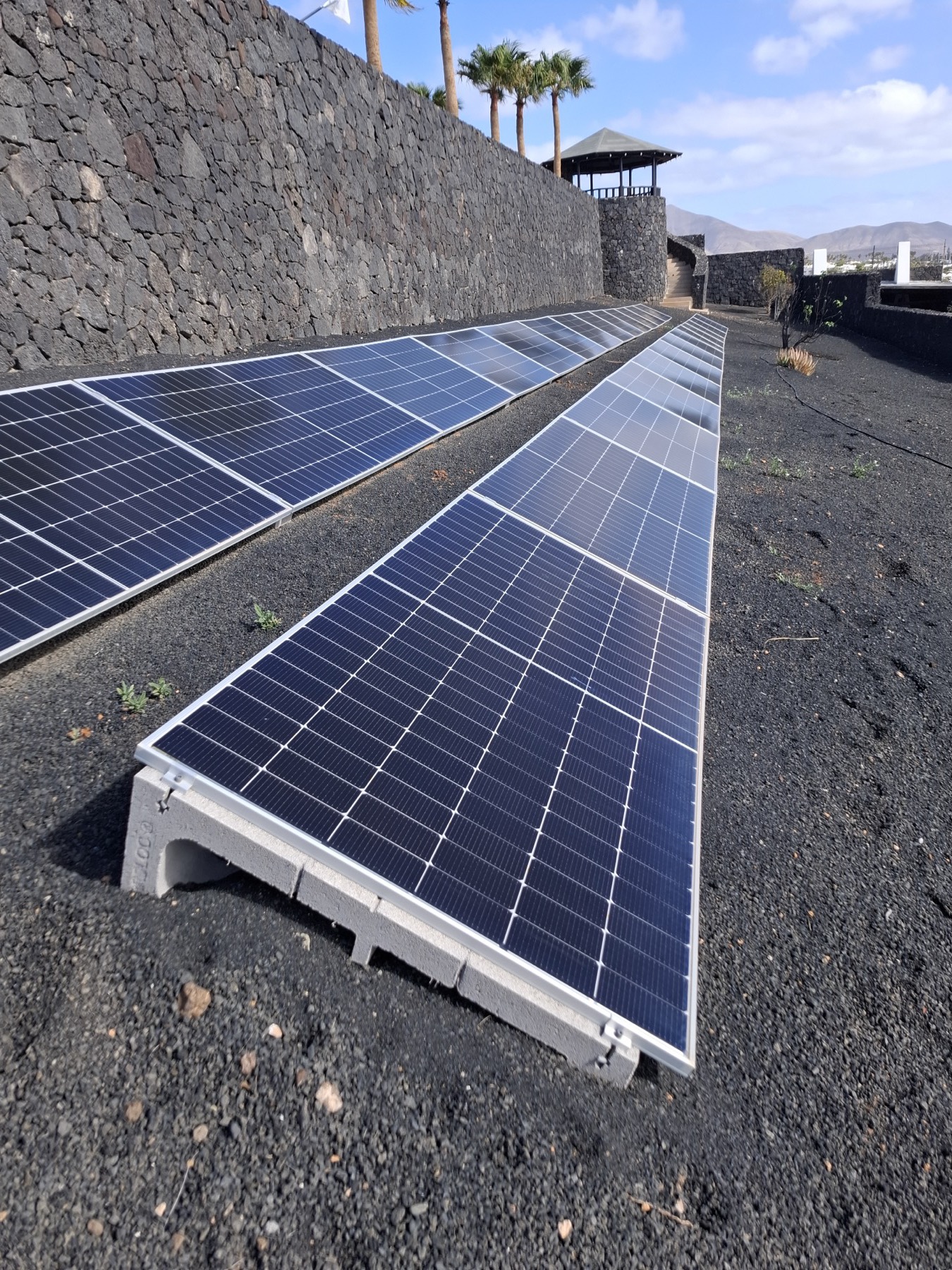 Ground-mounted solar array on volcanic gravel