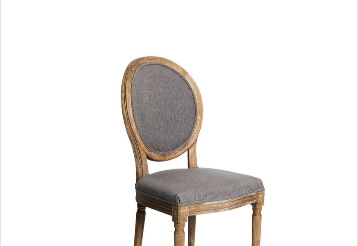Silla de respaldo ovalado tapizada en gris con acabado final revisado